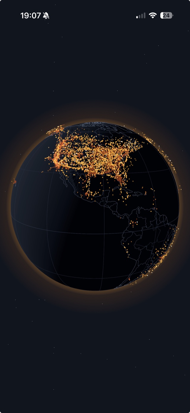 Contrail with the interface hidden: a dark globe ringed by an amber atmospheric glow, thousands of aircraft dots dense across North America and thinning to almost nothing over the oceans and South America.